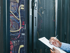 man managing a server room